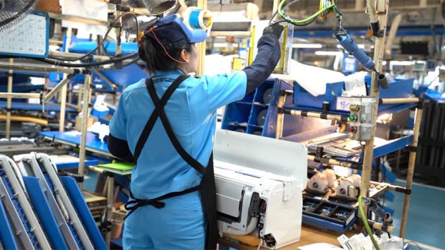 yatai in action header showing woman working in facotory