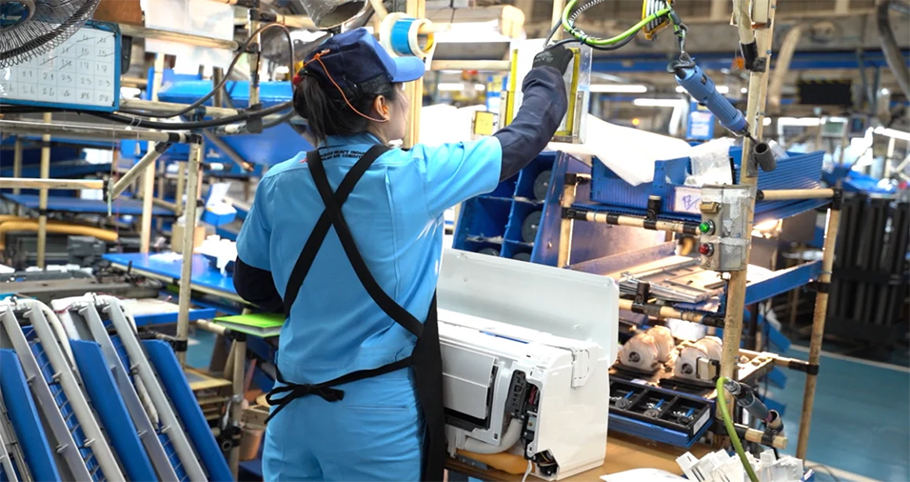 yatai in action header showing woman working in facotory